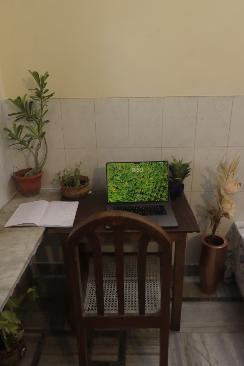 Study table and chair against the tiled wall.