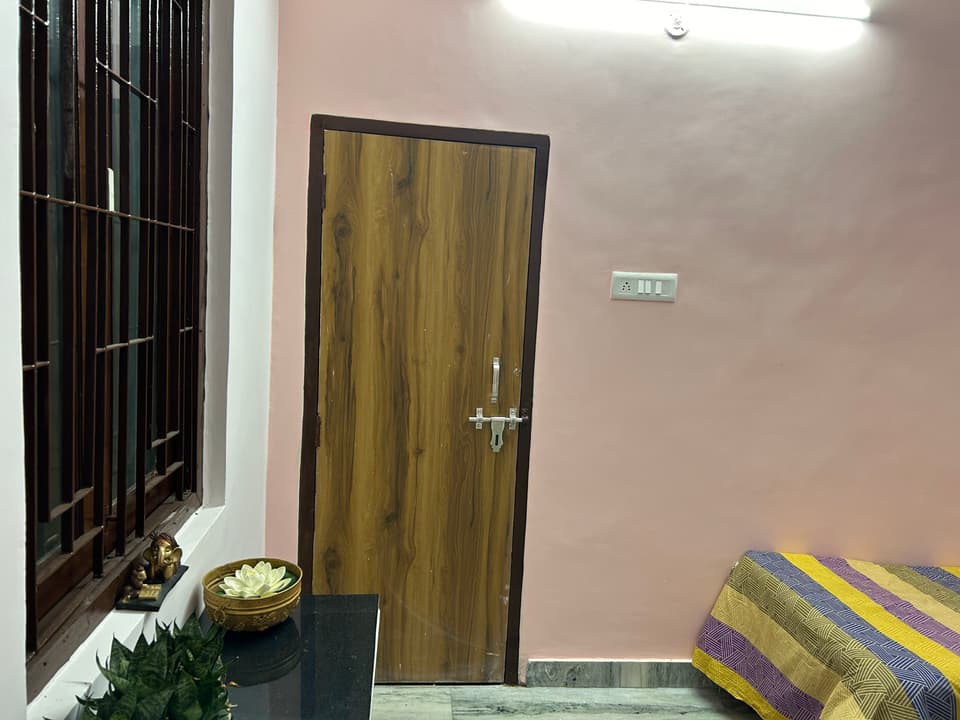 Tighter view of the single room furniture arrangement.