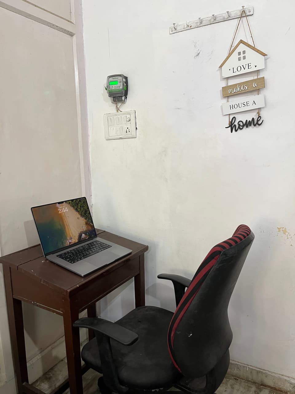 Study desk and chair against the room wall.