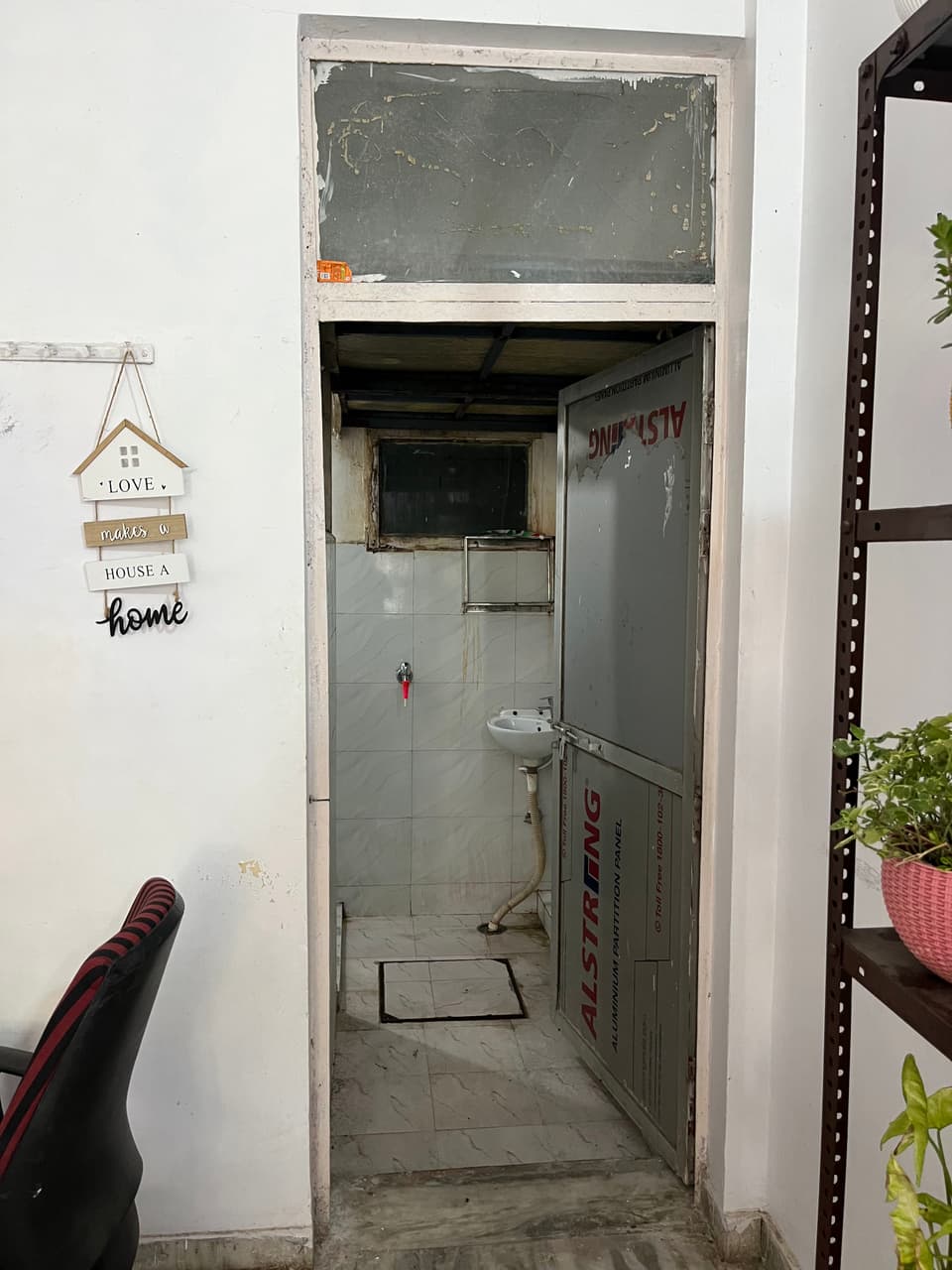 Entrance to the attached washroom beside the study desk.