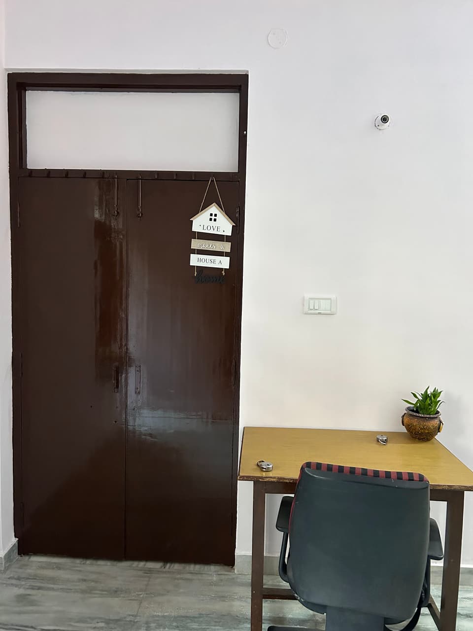 Wide interior view of the garden-view studio apartment.