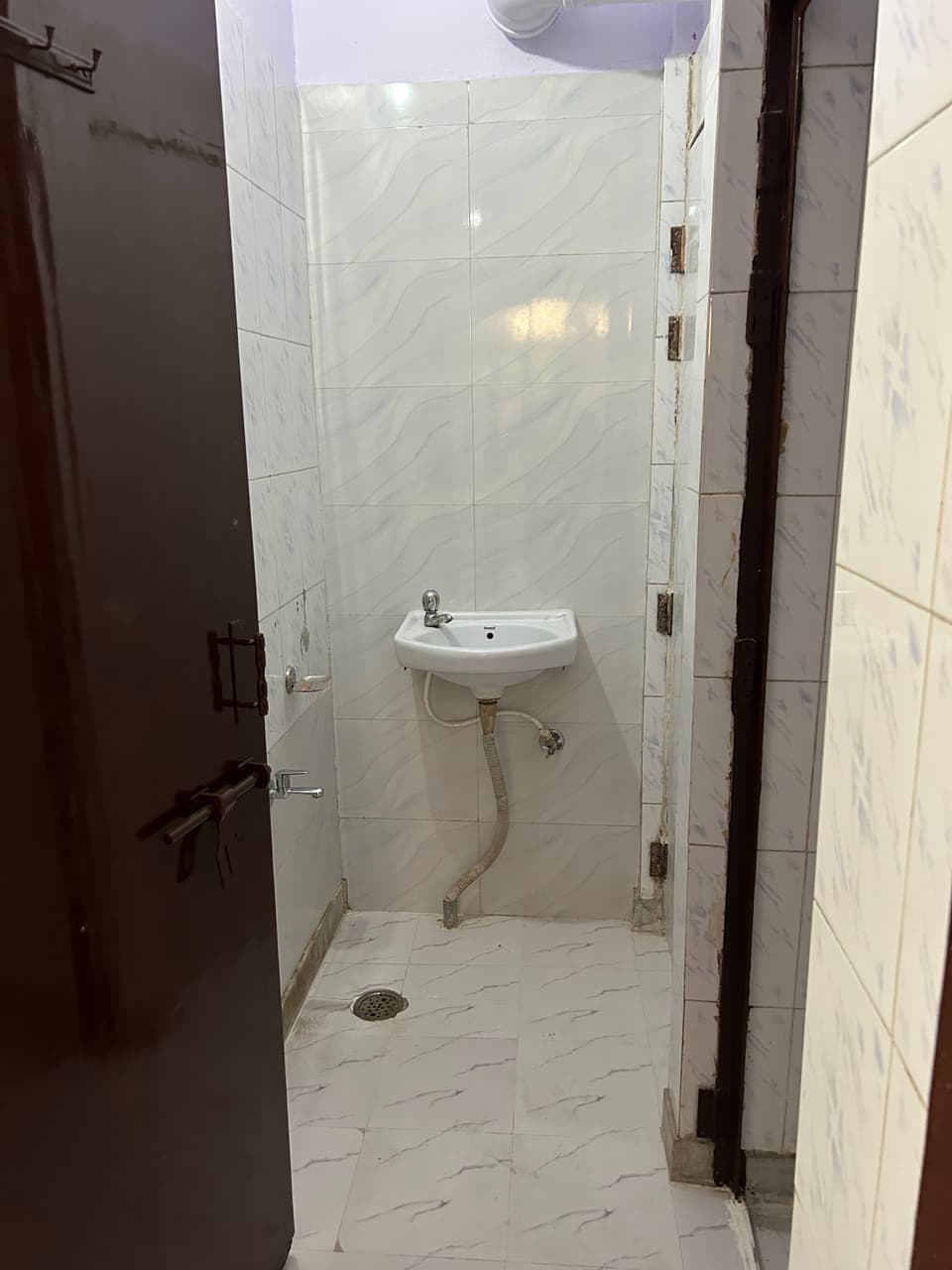 Furniture and circulation area inside the garden-view studio.