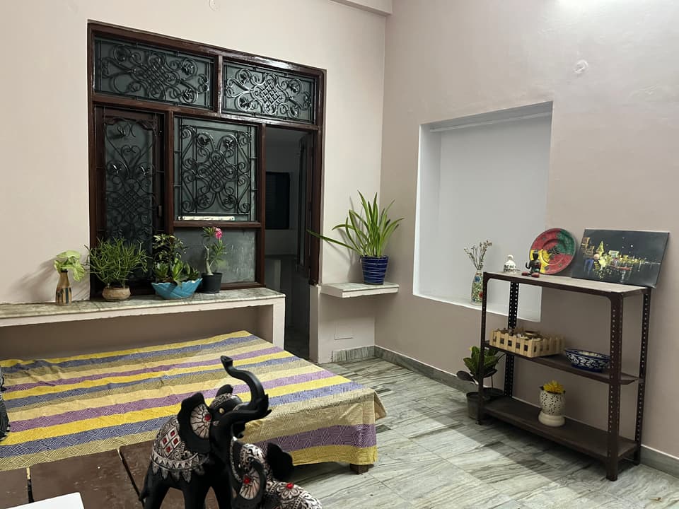 1 RK studio view with bed and long interior layout.