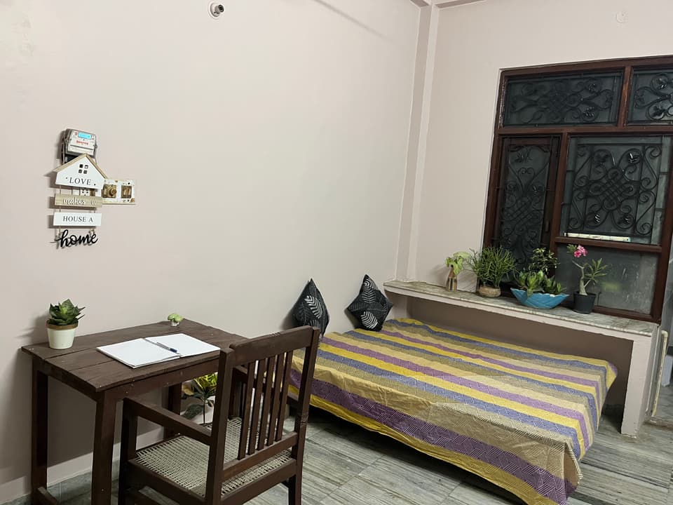 Study furniture and room depth inside the 1 RK studio.