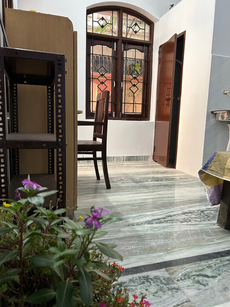 Wide view of the vibrant studio showing floor area and room height.