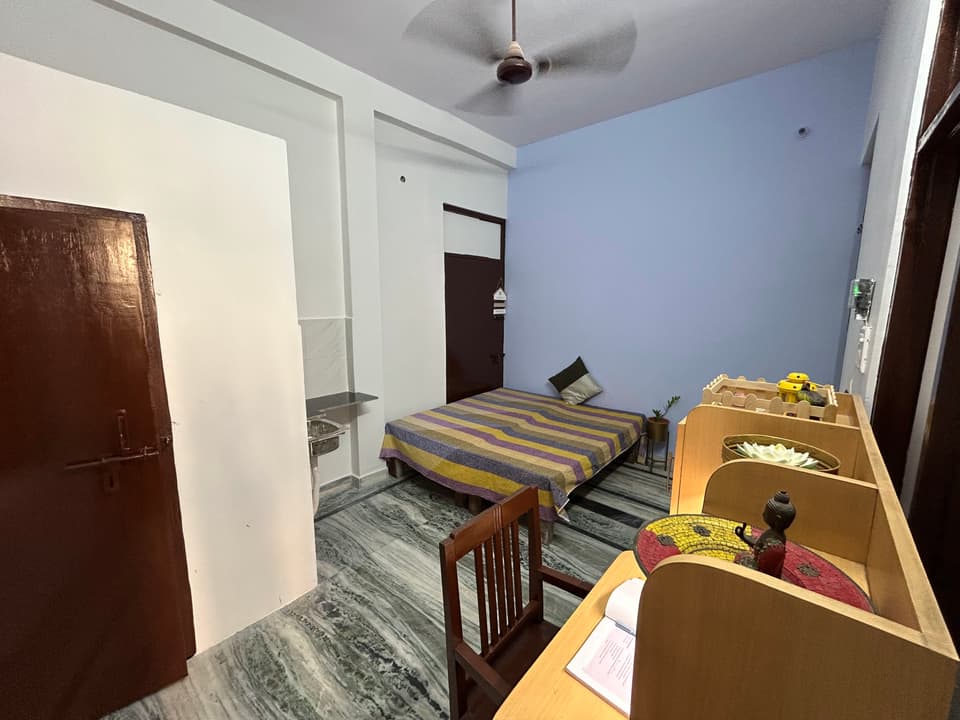 Room entry view inside the vibrant studio with attached facilities.